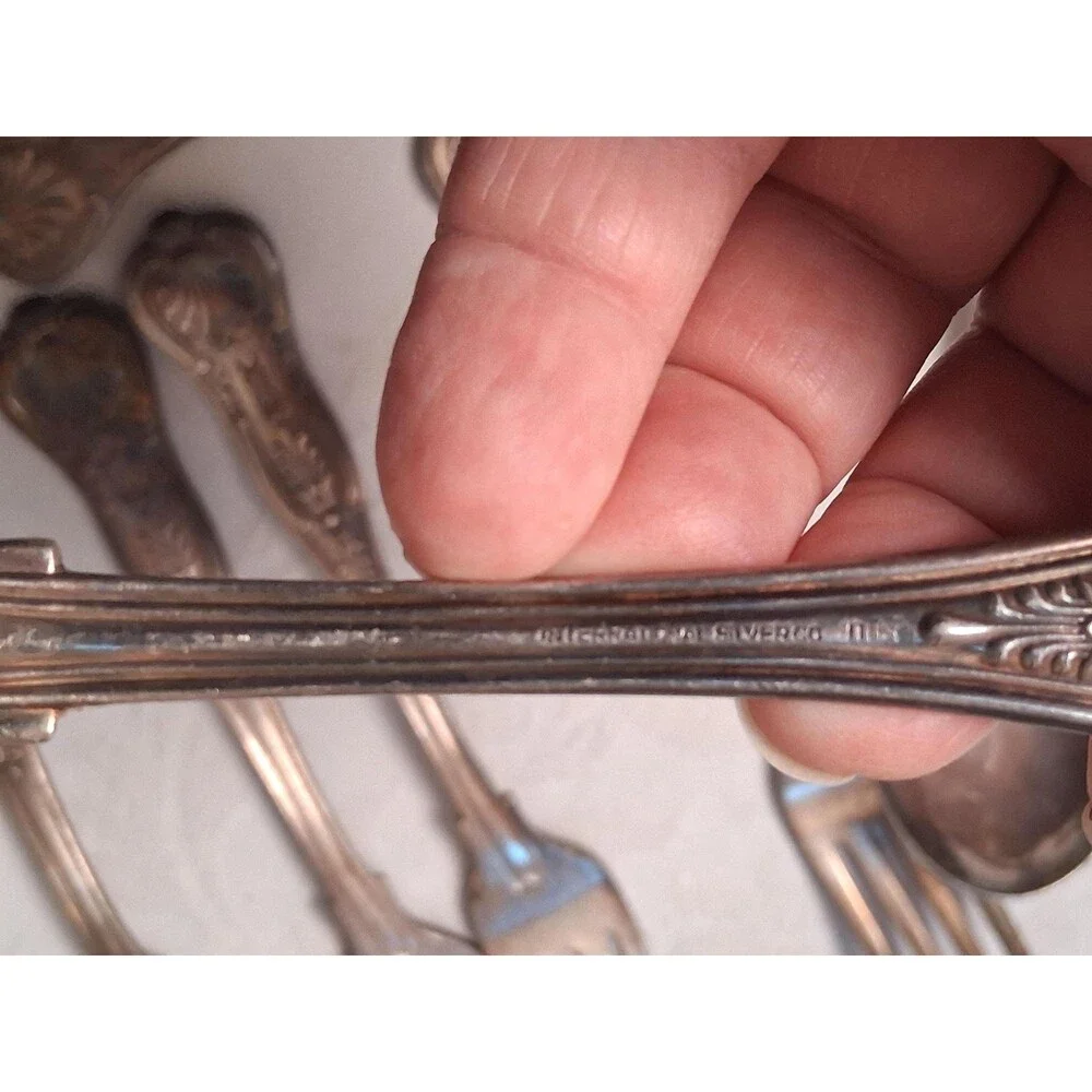 Unbranded pieces tarnish marked